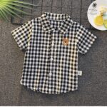Patterned Shirts - Black and white gingham short-sleeve button-down shirt featuring a brown bear chest embroidery