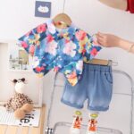 Short-Sleeved button-down shirt with a bold floral print and denim short -  Features a sky blue base with pink, red, and yellow floral patterns