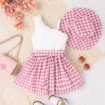 Pink Paris Asymmetric Dress - A chic dress featuring a white ribbed, one-shoulder ruffle top and a pink houndstooth flared skirt