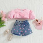 The Sweetheart Puff Denim Set - A cute pink puff-sleeve twist-front crop top paired with heart-embroidered denim shorts