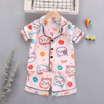 Weet Doodle Pastel Pajamas - A soft light-pink satin pajama set featuring a cute cartoon bear and floral doodle print - S